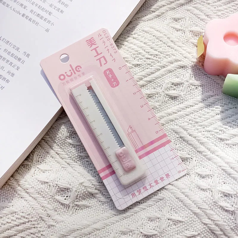 Small plastic blade art knife in five colour options measuring 7.2 by 1.5 centimetres