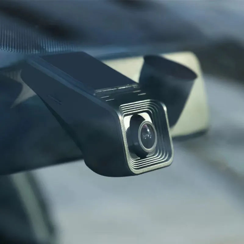 HD night vision car driving recorder dash camera on a windscreen.