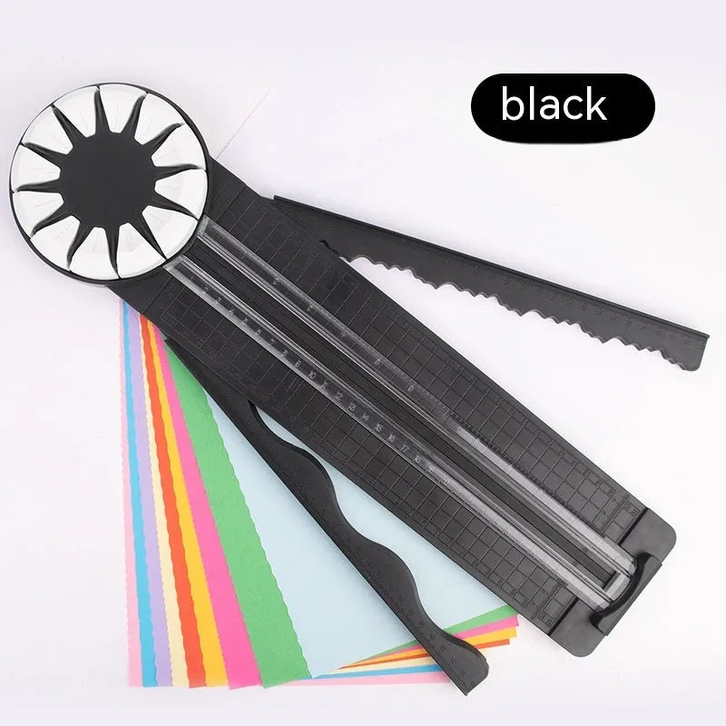 Pink and black 12-in-1 manual plastic paper cutting machine on a white background.