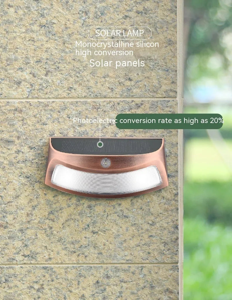 Solar-powered outdoor wall lamp with smiling face design for garden lighting