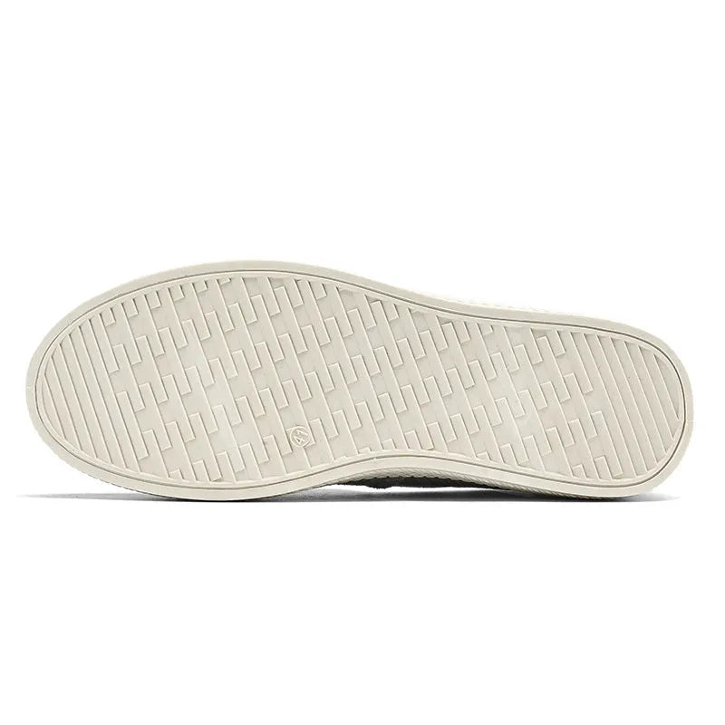 Men's beige canvas slip-on shoes with round toe and PVC sole on a plain background