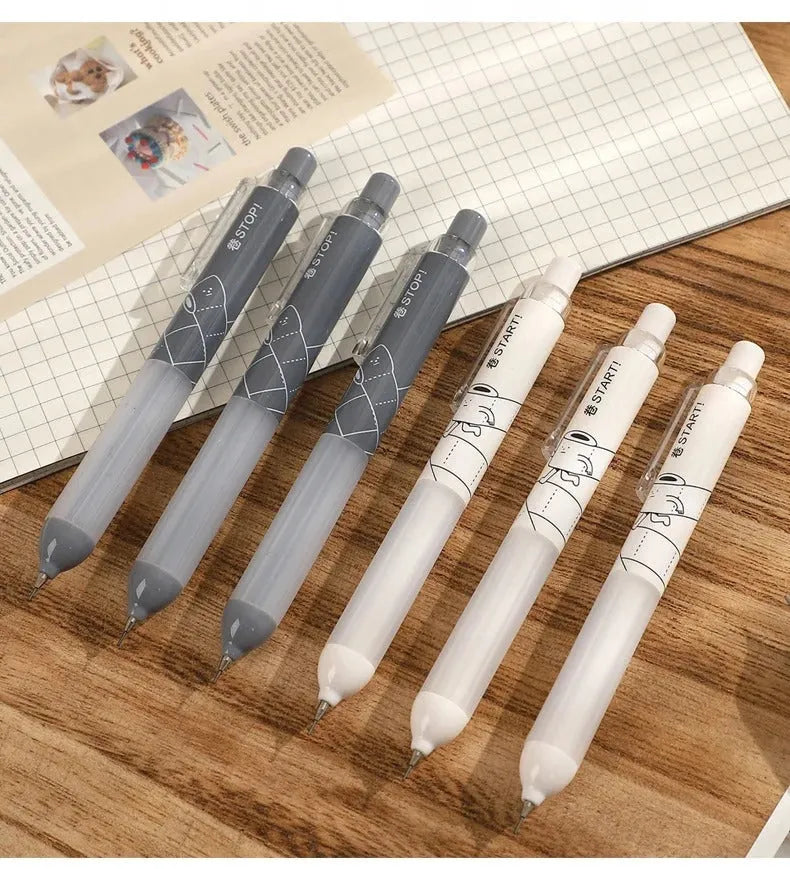 Black and white 0.5mm automatic pencils with cloud grip plastic holders on minimalist background