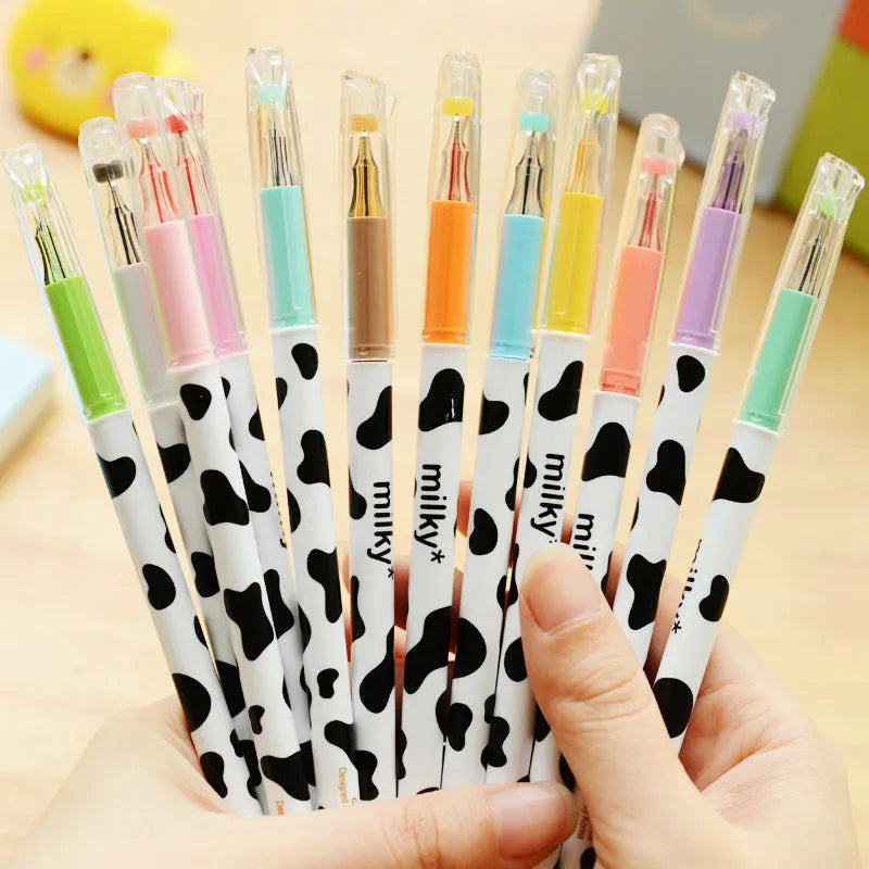 Cow pattern gel pen set showing 12 coloured pens with 0.38mm fine tips