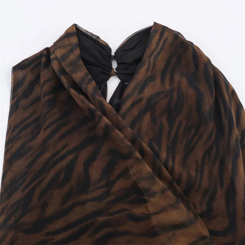Animal print double breasted mini dress with pleated asymmetric skirt and long sleeves in mercerised cotton