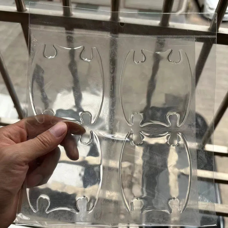 Transparent 3D adhesive protectors for car door handle bowls in a 4-piece set.