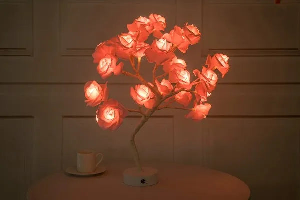 Rose flower LED table lamp with warm white glow on a flat surface, showing PE cotton flowers and bonsai tree shape
