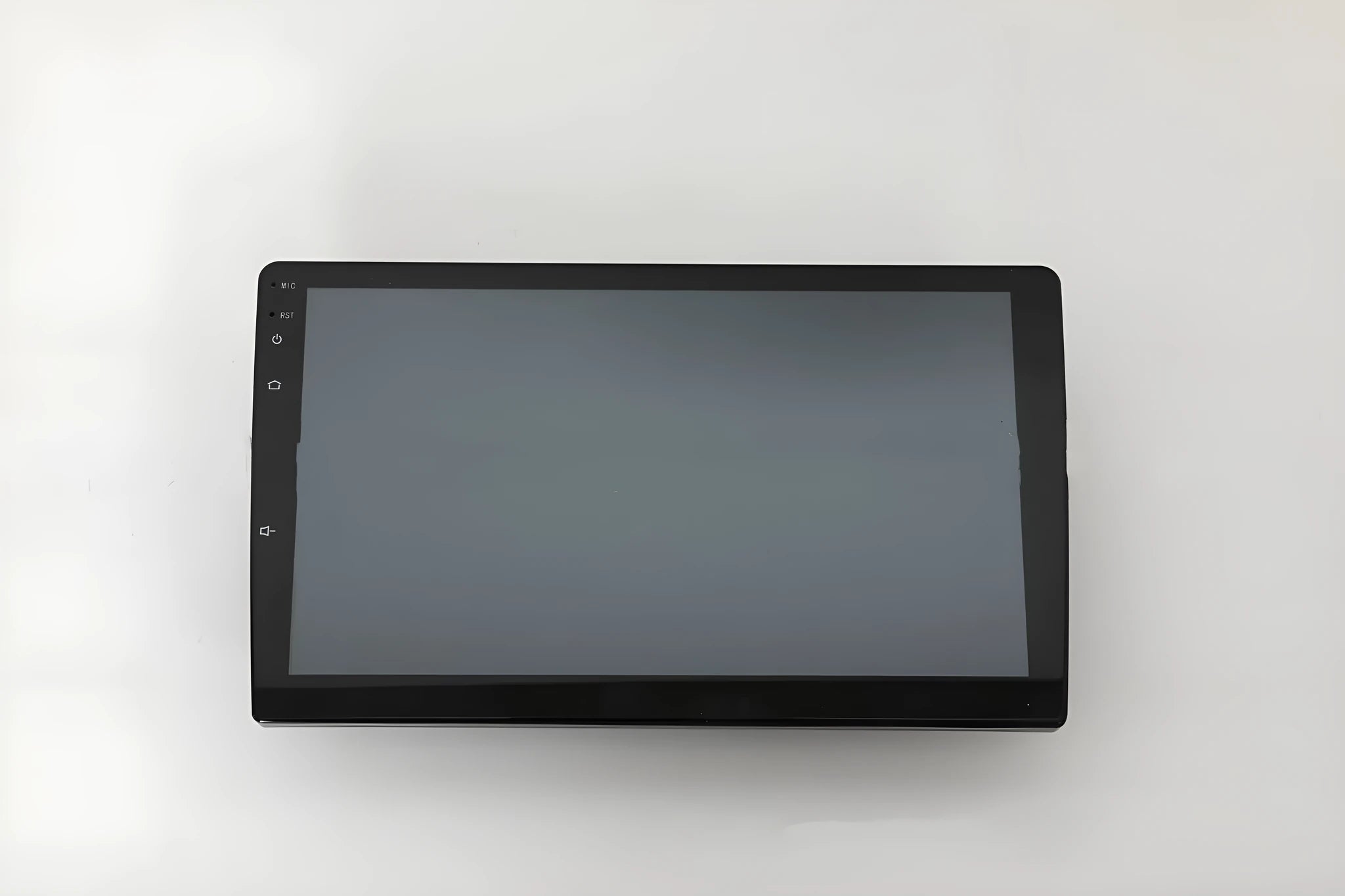 10.1 inch universal Android car stereo head unit with trapezoid touch screen display for dashboard installation.