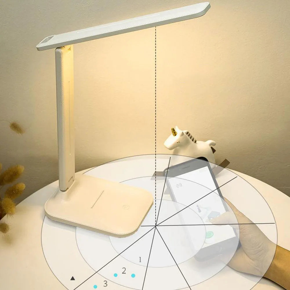 White plastic touch dimming bedside lamp with USB charging cable.