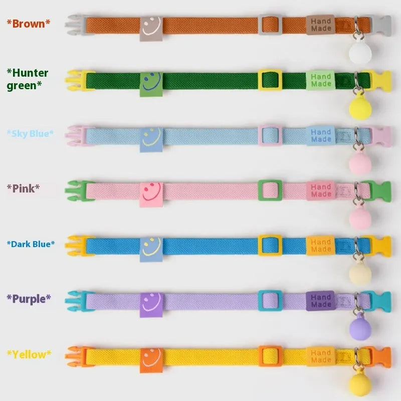 A high elasticity polyester dog collar for small dogs, shown in one of seven colours: yellow, pink, sky blue, purple, brown, dark blue or dark green.