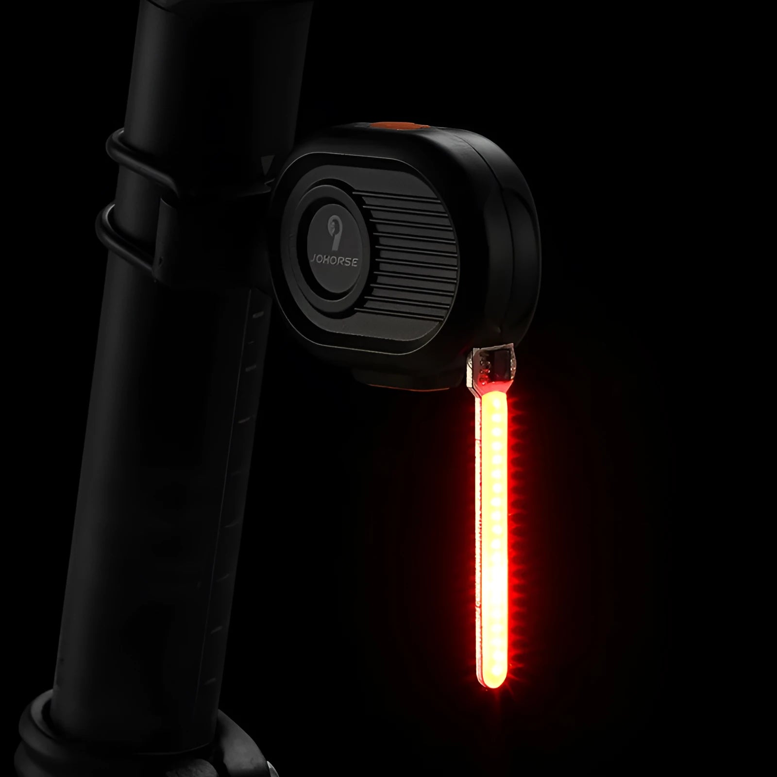 Blue bicycle taillight showing a running water drops light pattern, mounted on a bike seat post.