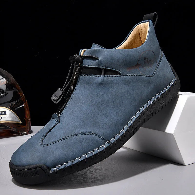 Men's black casual leather shoes with a mid heel and round toe on a rubber sole