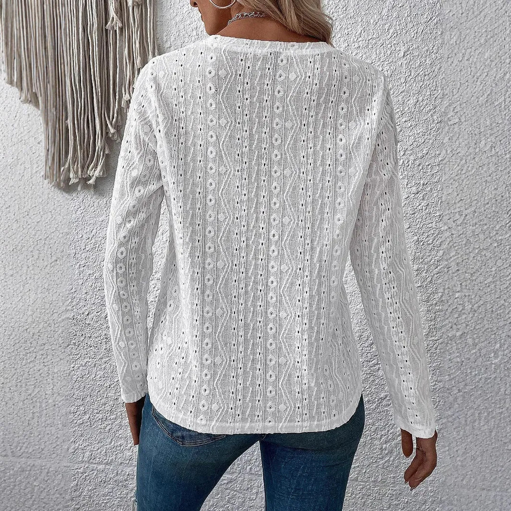 White loose fit long sleeve round neck polyester pullover top laid flat
