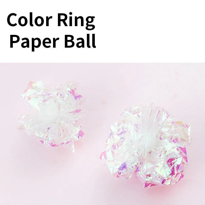 White noise-making paper ball cat toy on floor for indoor cat play