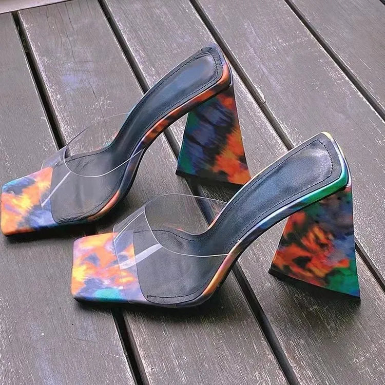 Women's black square toe slippers with a thick triangle heel and rubber sole.