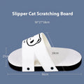 White corrugated paper cat scratch board in a slipper shape on a floor.
