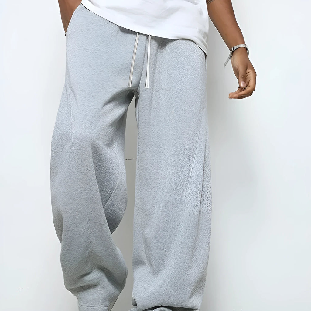 Men's solid colour casual trousers with a micro-elastic waistband and straight-leg cut.