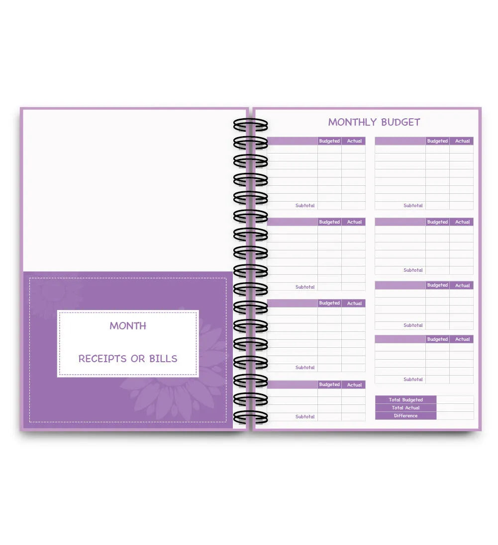 Purple coil-bound budget book with stickers and paper clips for monthly financial planning