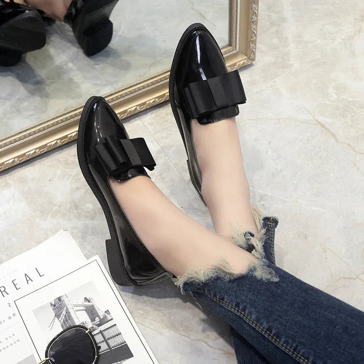 Women's patent leather bowtie flat loafers with pointed toe and low heel in black and claret