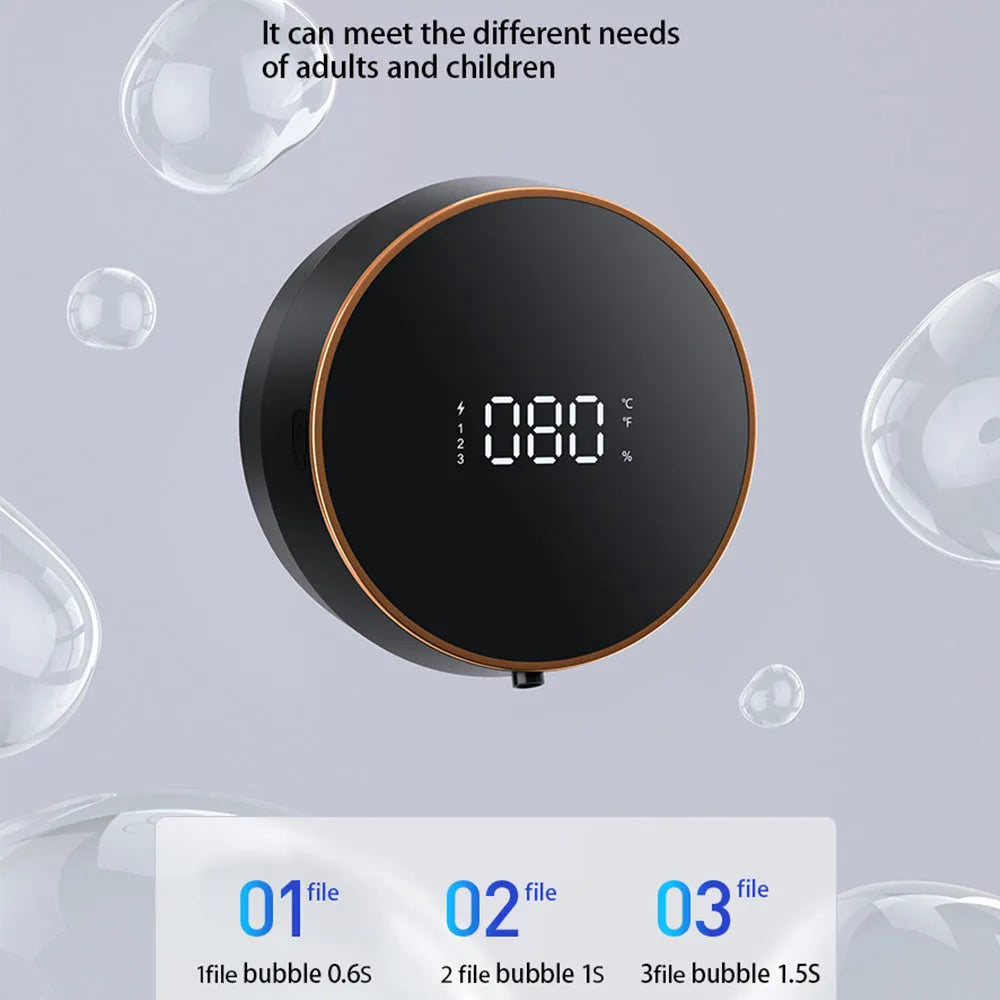 Black automatic foam soap dispenser mounted on wall with USB charging cable