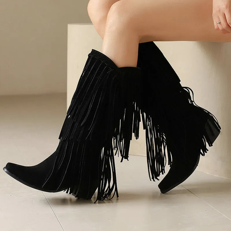 Women's brown suede knee-high boots with tassels and a chunky waterproof platform sole.