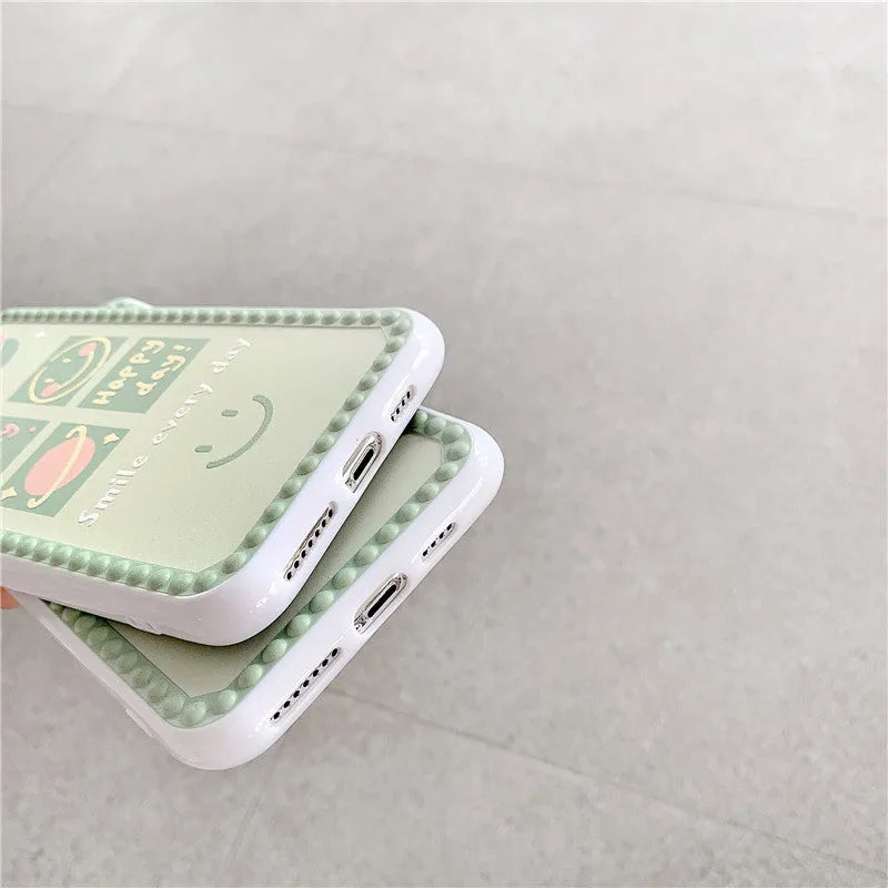 Green TPU iPhone case with geometric shapes and smiley faces inside a polka dot frame.