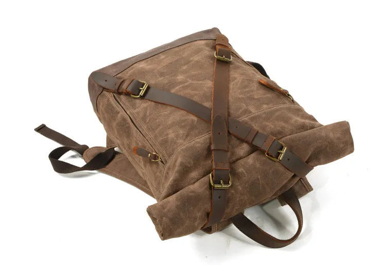 Waterproof canvas rucksack with linen lining, 20-35L capacity, softback design, shown in black, coffee, or celadon colour options.