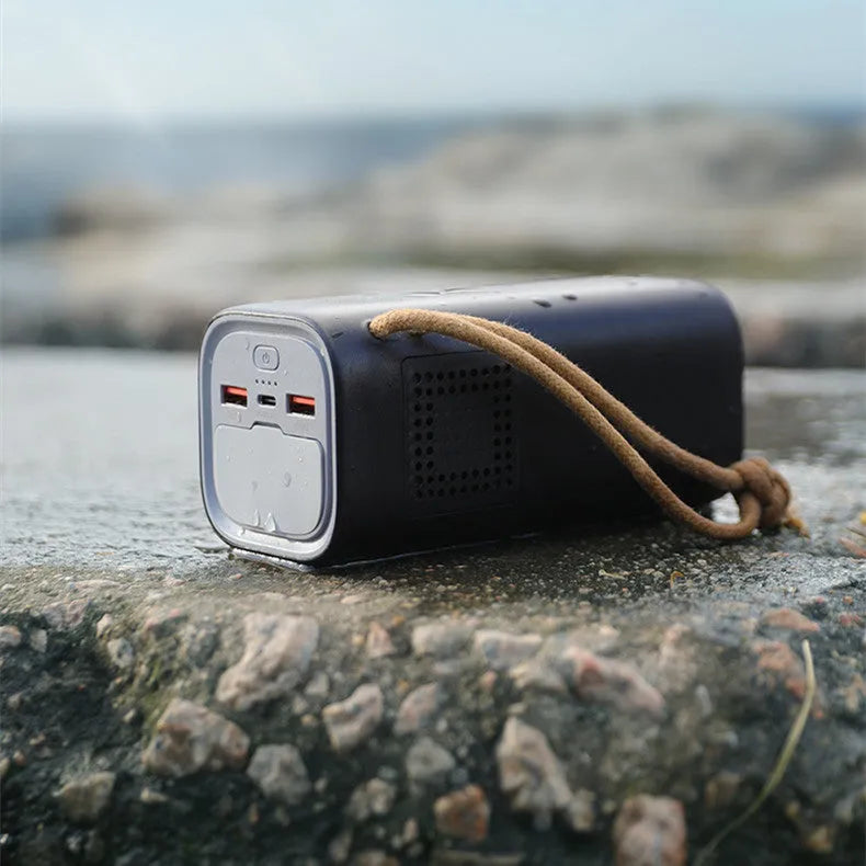 Black portable power bank with solar panel, 20000mAh capacity, and 200W maximum output power
