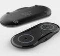 Black dual wireless charging pad charging two smartphones simultaneously with Type-C cable