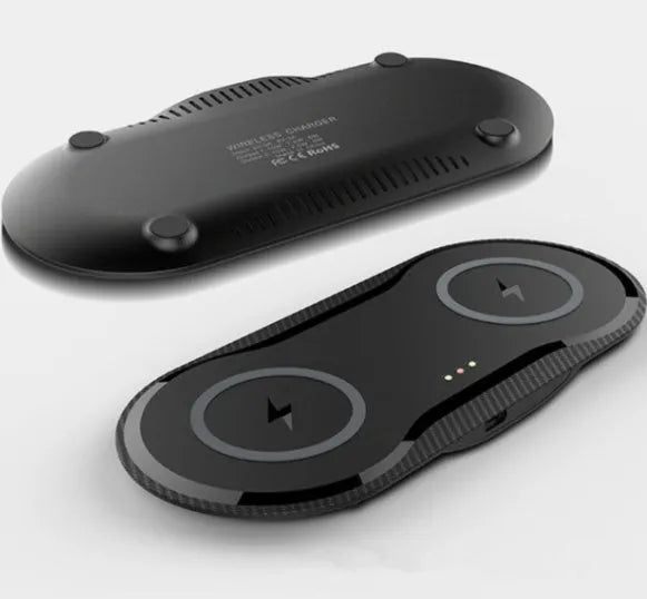 Black dual wireless charging pad charging two smartphones simultaneously with Type-C cable