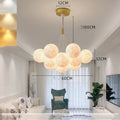 Nordic fish chandelier pendant lamp with spherical elements in gold or black iron finish