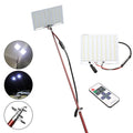 White LED fishing rod light with telescopic pole extended, showing remote control and connection cables