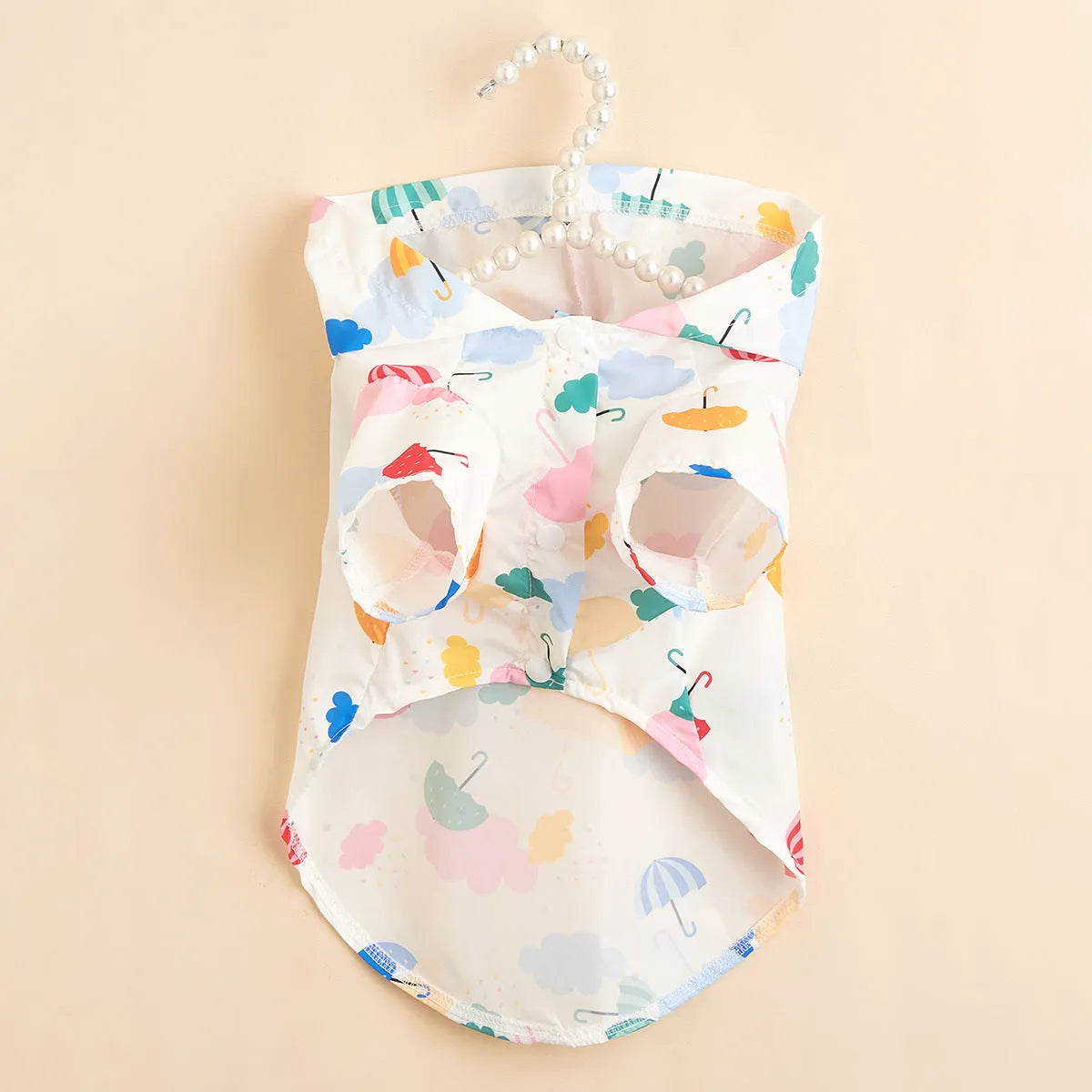 Colourful cartoon umbrella pattern dog or cat raincoat in polyester fabric.