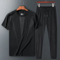 Two-piece nylon sportswear set with short-sleeved round-neck T-shirt and trousers in black blue and white