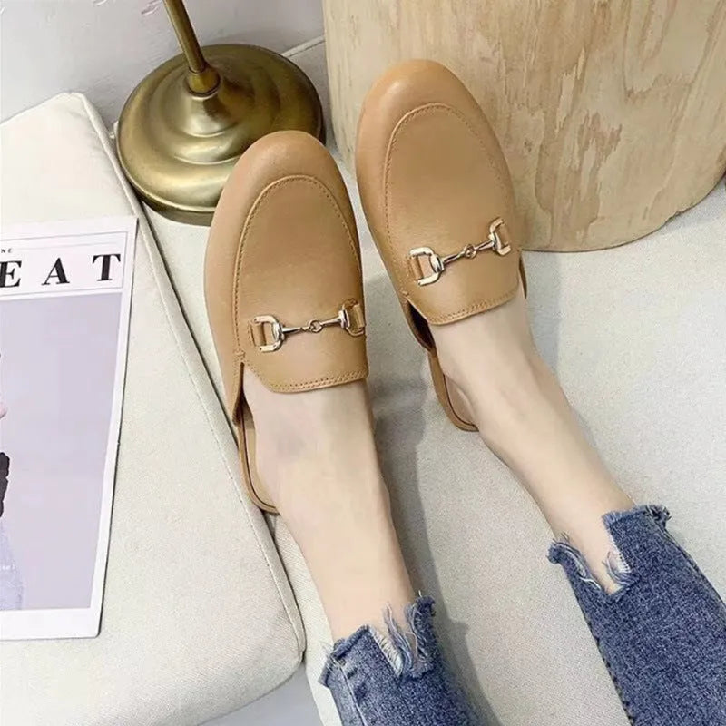 Women's PVC closed-toe half slippers with metal buckle in choice of colours.