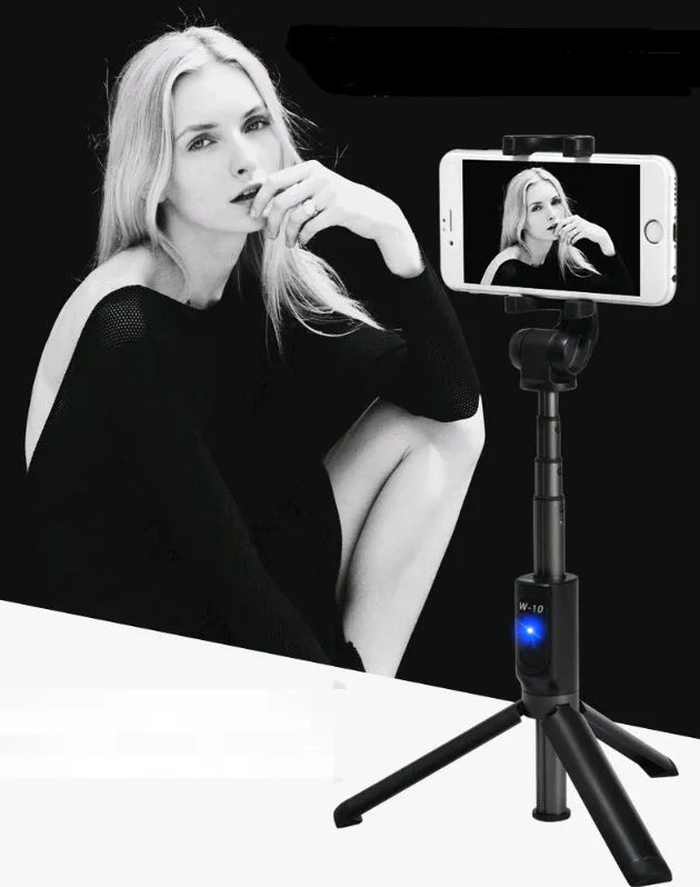 Black Bluetooth selfie stick with tripod bracket extended, holding smartphone