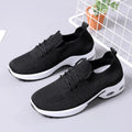 Women's black mesh casual sneakers with lace-up front and round toe on a soft PVC sole.