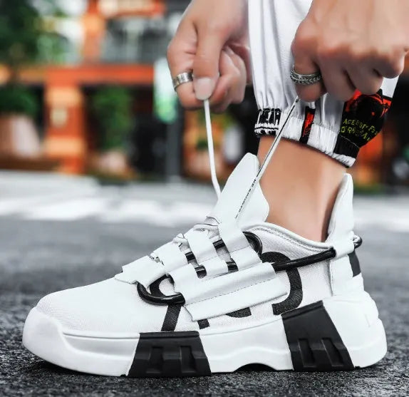 Platform sneakers in black with front strap closure, breathable flying line upper, MD sole, lace-up design