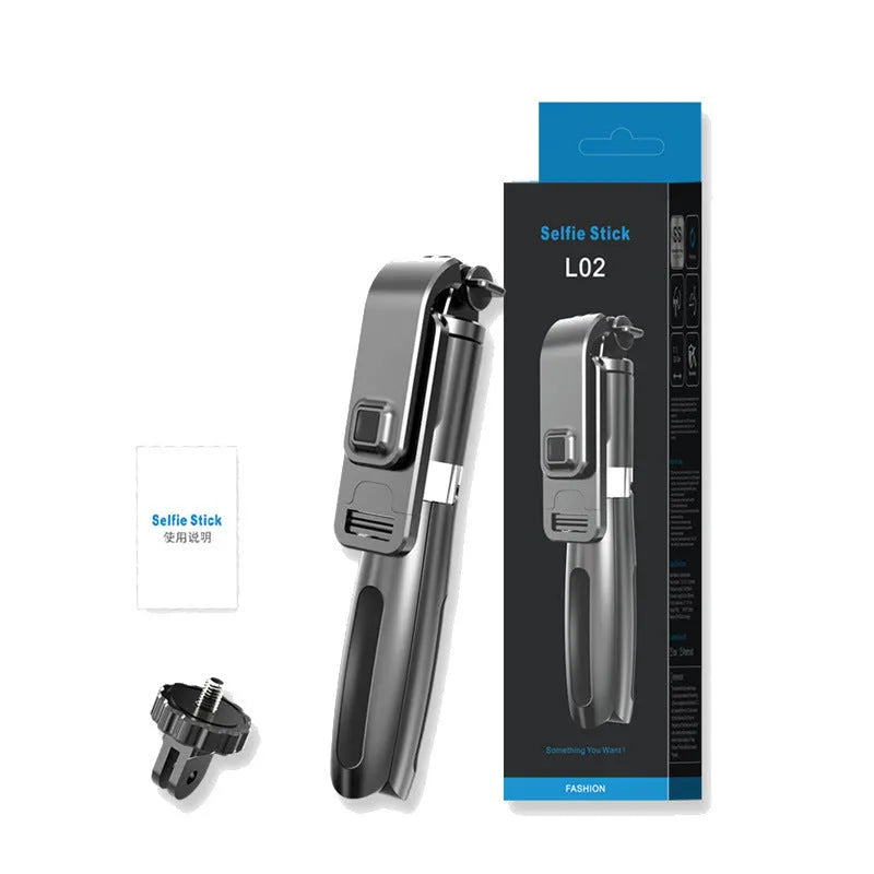 Black Bluetooth selfie stick with wireless remote, extended next to a phone and GoPro camera on its tripod base.