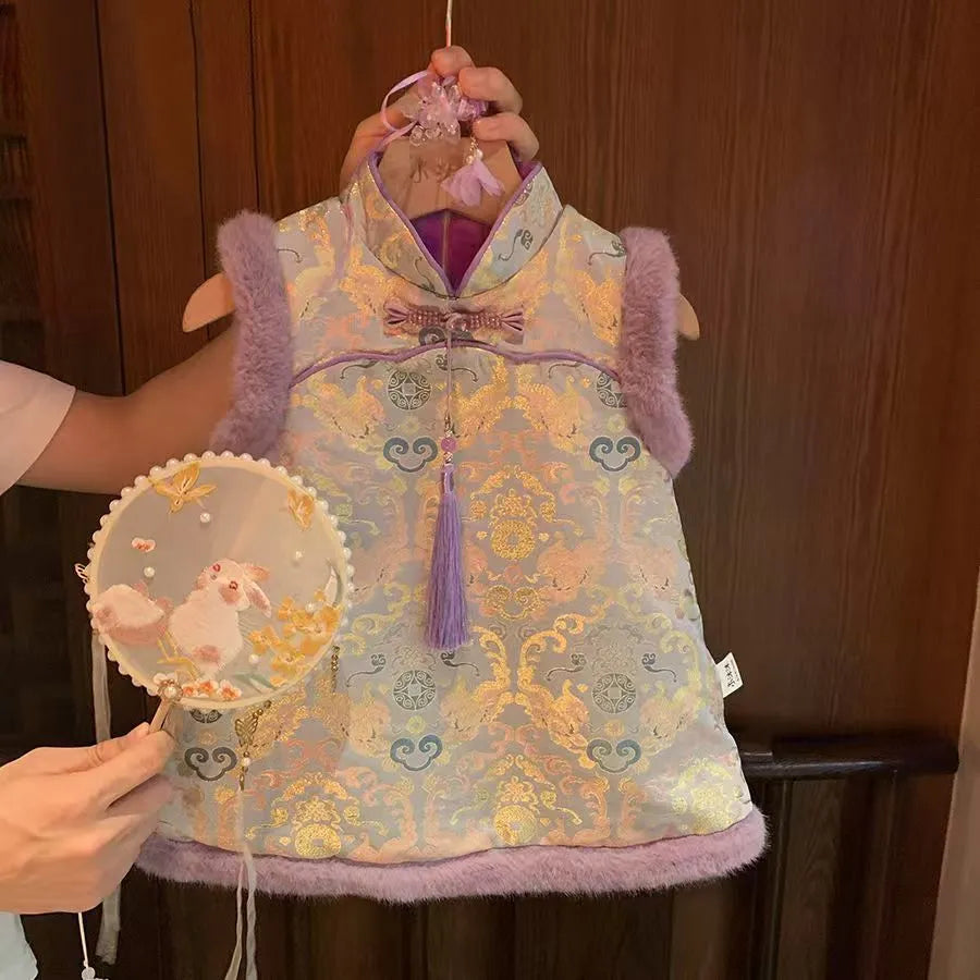 Girls' velvet padded cheongsam dress with floral pattern in purple colour on display