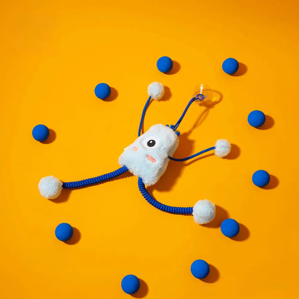 Blue plush cat toy with a telescopic elastic rope and a mint-coloured bell ring on a white surface.