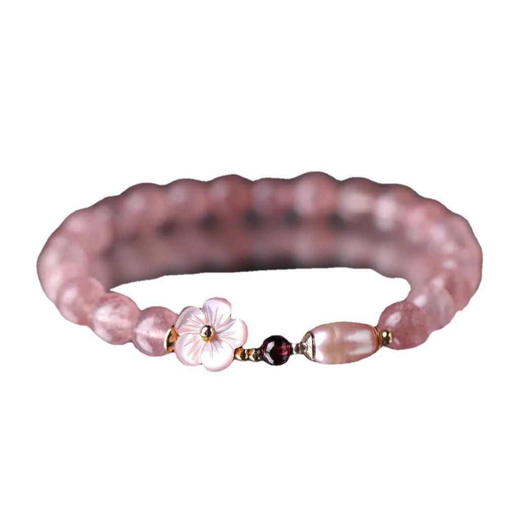 Strawberry quartz crystal bracelet with flower-shaped design on adjustable band for women