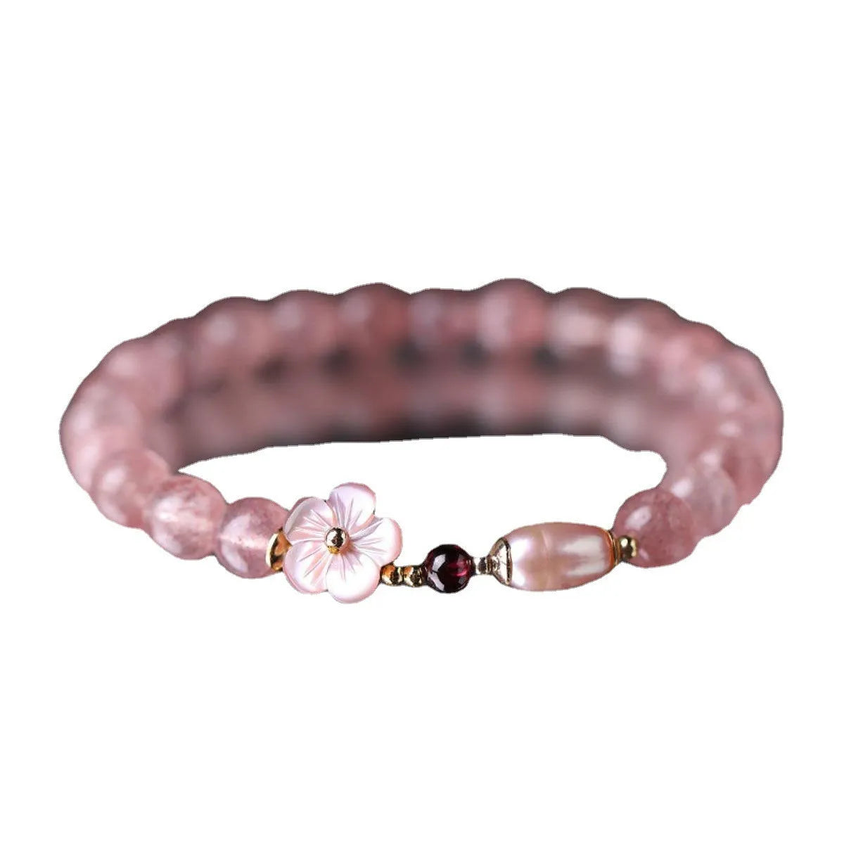 Strawberry quartz crystal bracelet with flower-shaped design on adjustable band for women