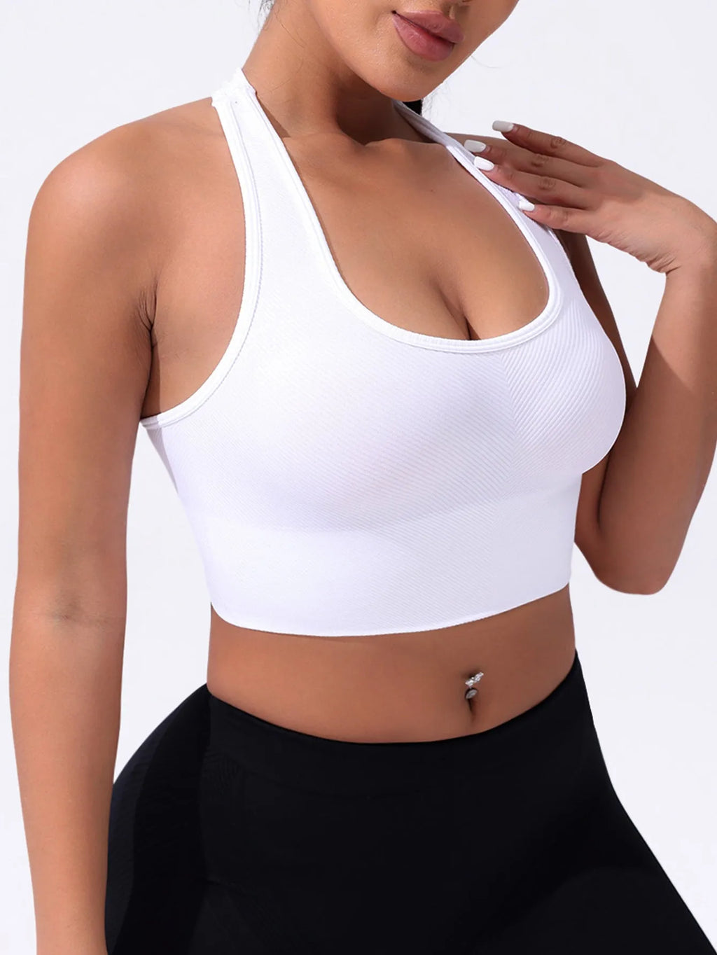 Black women's sports bra with cross back design and full cup support for athletic wear.