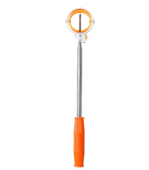 Retractable stainless steel golf ball picker extended to 2m, lying on green grass