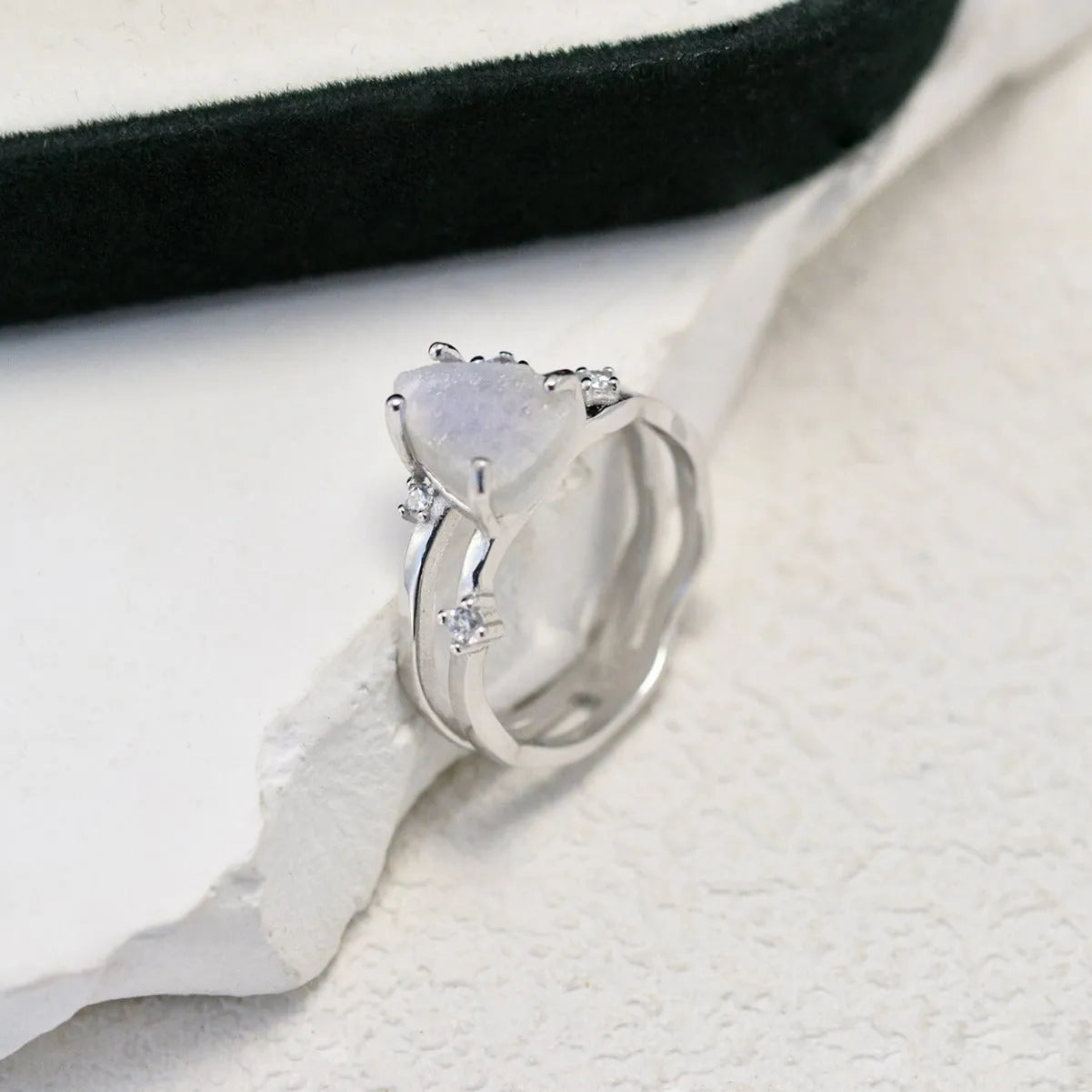 S925 silver geometric ring with triangular moonstone in rose, white, or yellow gold plating on a size guide.