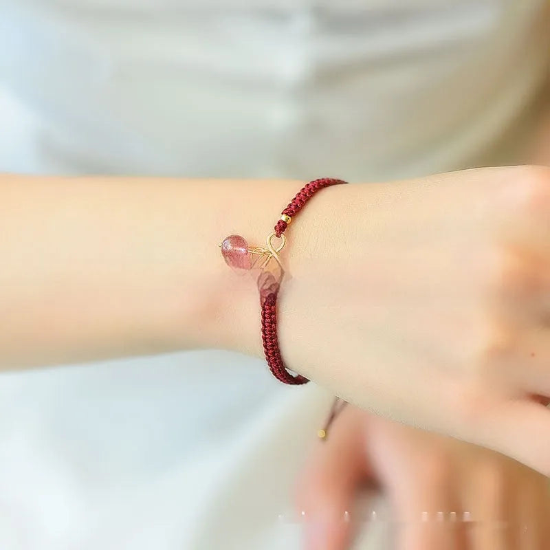 Women's natural strawberry quartz bracelet with fruit-shaped pendant and adjustable cord closure