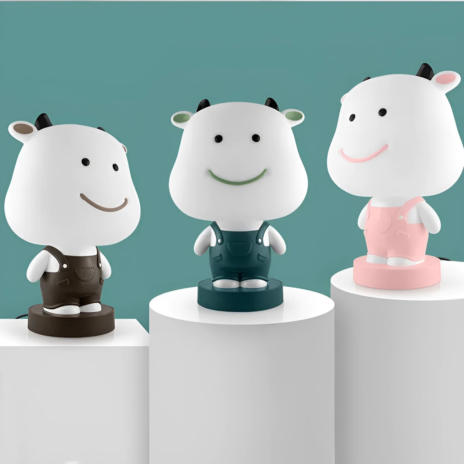 Cartoon animal table lamp in plastic, available as a bear, cow, rabbit, or tiger design.