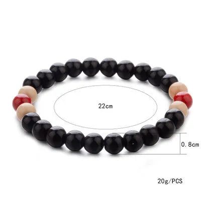 Natural lava stone bead bracelet for men and women on a wrist, showing ethnic style and essential oil application.