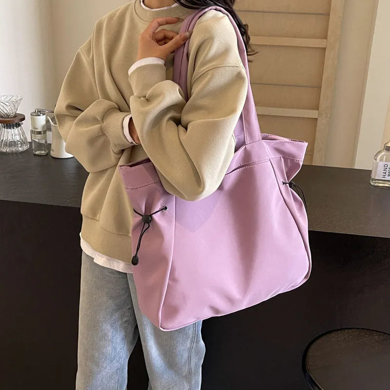Soft foldable Oxford cloth commuter shoulder tote bag shown in light grey colour.