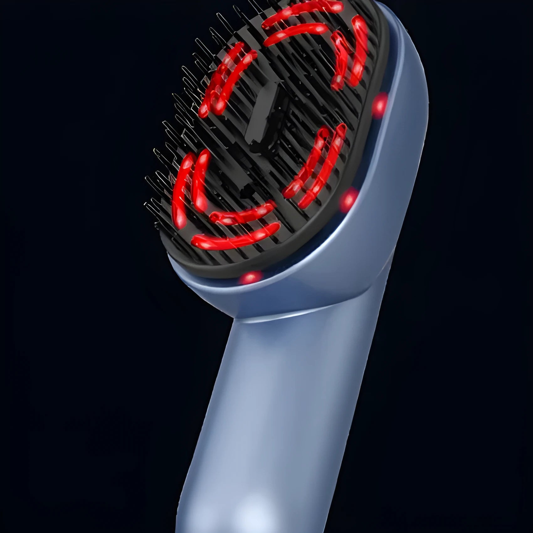 Red and black atomized massage comb with USB Type-C charging port and atomiser reservoir.